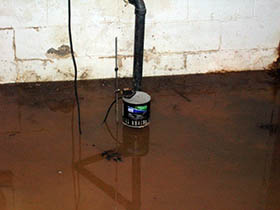 Flooded basement with sump pump disabled by power outage.
